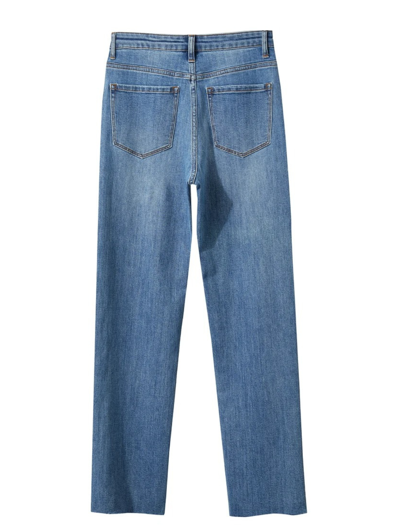 The backside of a pair of pencil cut, ankle length, jeans in denim blue.
